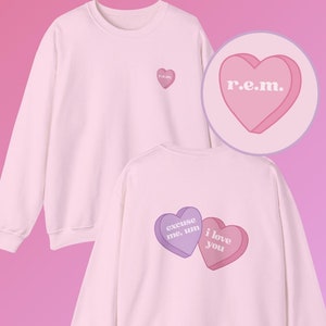 R.E.M. Ariana Candy Heart Grande-tröja Unisex Heavy Blend™ Crewneck-tröja Rem Beauty Eternal Sunshine Blush hypernova