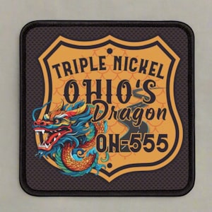 May include: A yellow and orange patch with a black border. The patch features a stylized dragon with a blue and green body and a red head. The text "Triple Nickel Ohio's Dragon OH-555" is printed on the patch.