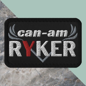 May include: Black embroidered patch with white text that reads "can-am RYKER" with a red "Y".