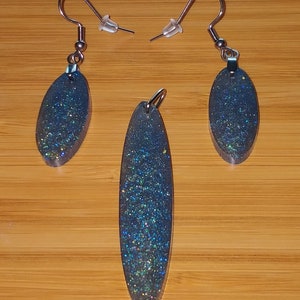 Glittery blue and green resin oval earrings and pendant