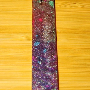 Rectangle glittery blue and purple resin pendant