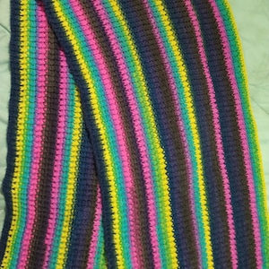 Blue, pink, yellow, green, charcoal, and purple crocheted wrap