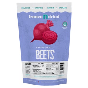 May include: A bag of freeze-dried beetroot. The bag is purple with a picture of a beetroot on the front. The bag says "freeze dried beetroot" and "up to 30 year shelf life".