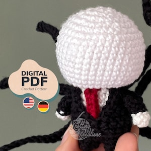 May include: A crochet amigurumi figure with a round white head, a black suit, and a red tie. The figure has long black appendages extending from its back. A digital overlay reads DIGITAL PDF Crochet Pattern with US and German flag icons.