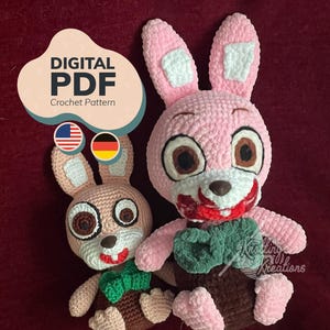 May include: Two crocheted bunny dolls with pink and tan bodies, brown eyes, and green bow ties. The bunnies have a stitched mouth and are sitting on a burgundy surface. The image includes text that says "DIGITAL PDF Crochet Pattern".