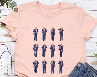 Op de afbeelding: Een roze T-shirt met een grafische print van een man in pak die verschillende dansbewegingen maakt. De afbeelding wordt 12 keer op het T-shirt herhaald.