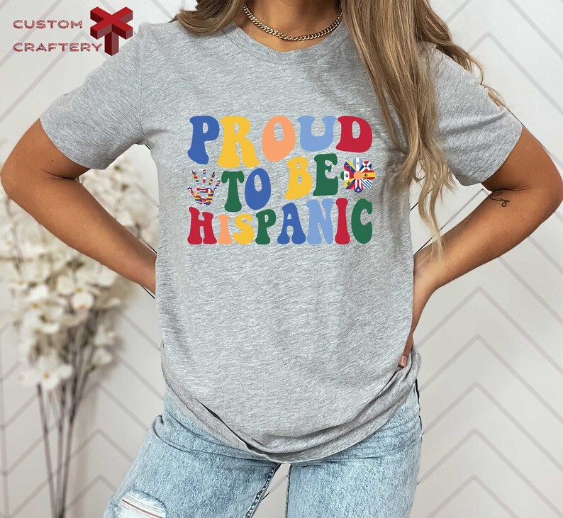 a woman wearing a t - shirt that says proud to be hispanic