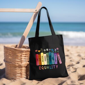 a black bag sitting on top of a sandy beach