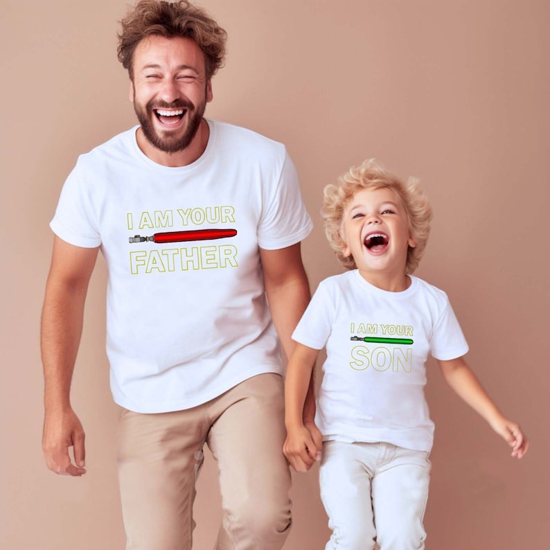 May include: Two white t-shirts with a lightsaber graphic and the text "I am your Father" and "I am your Son".