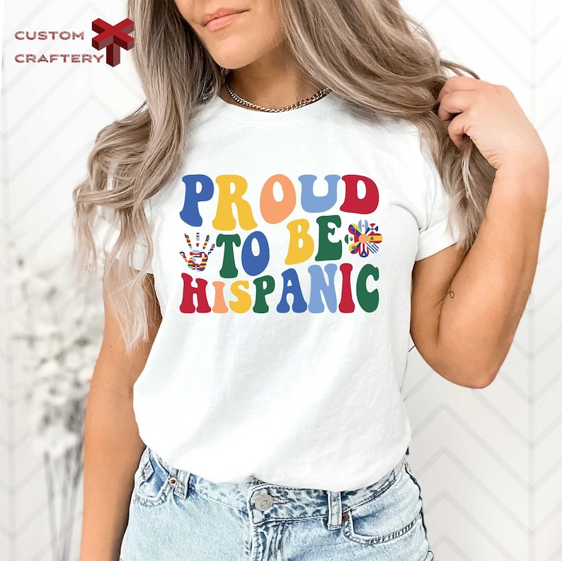 a woman wearing a t - shirt that says proud to be hispanic