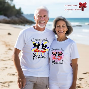 a man and woman standing on a beach next to the ocean