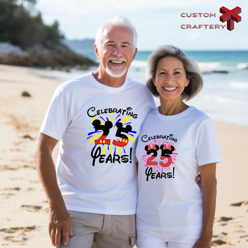 a man and woman standing on a beach next to the ocean