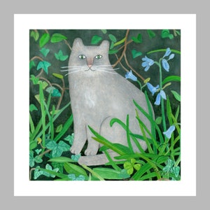 May include: A grey cat sits in a garden with green leaves and blue flowers. The cat has green eyes and a white patch on its chest.