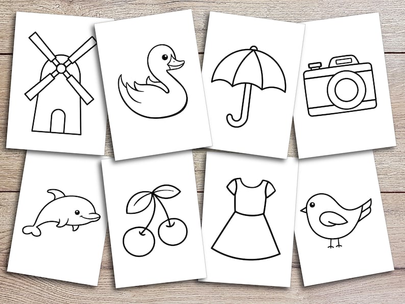 Puede incluir: Dibujos en blanco y negro de varios objetos, incluyendo un molino de viento, un pato, un paraguas, una c&aacute;mara, un delf&iacute;n, cerezas, un vestido y un p&aacute;jaro.