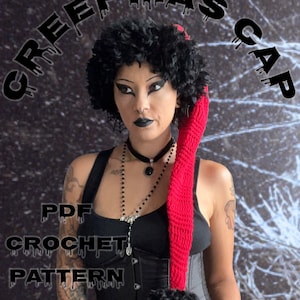 May include: A crochet pattern for a red and black "Creepmas Cap" with a pom-pom. The pattern is available as a PDF download.  PDF CROCHET PATTERN ONLY.