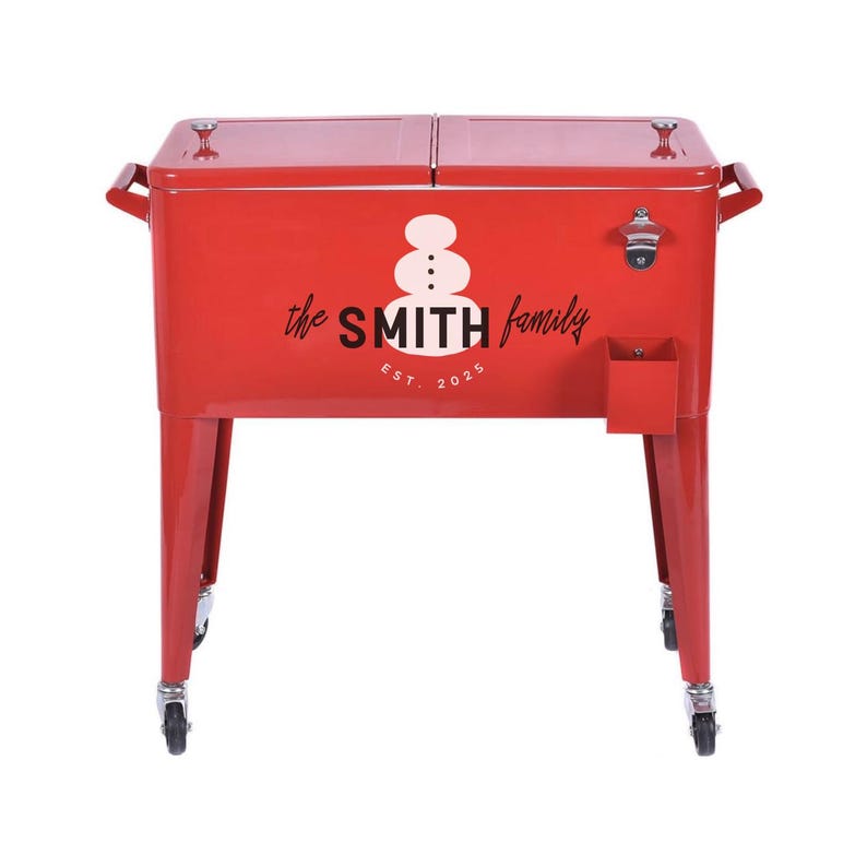 May include: A red metal cooler with the text "the SMITH family EST. 2025" and a snowman graphic. The cooler has a bottle opener, a small storage compartment, and is mounted on wheels.