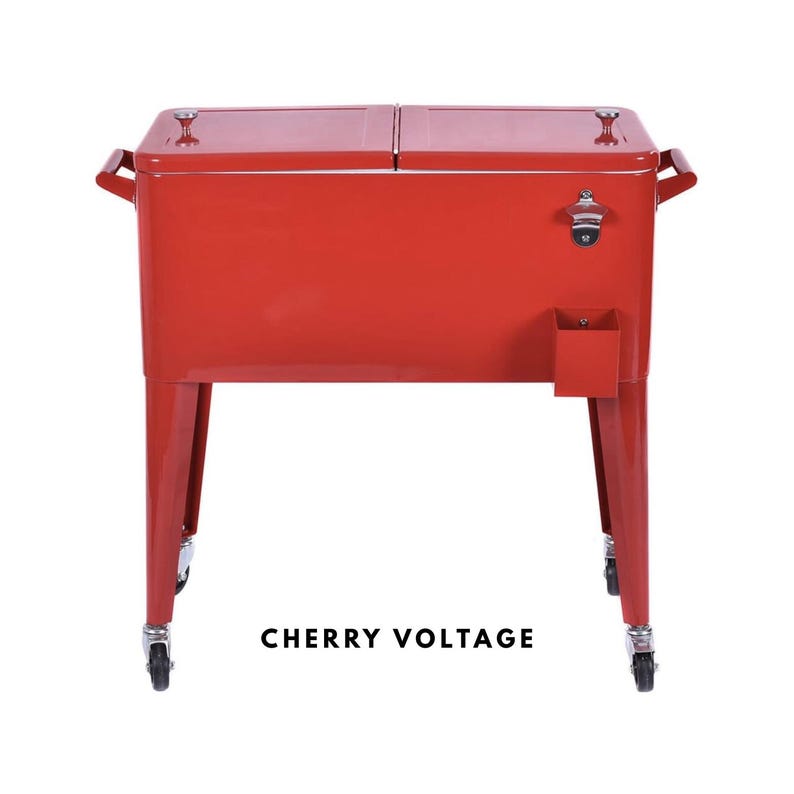 May include: A cherry red metal cooler with a bottle opener and a small storage compartment. The cooler has two hinged lids, side handles, and sits on four legs with wheels. The text "CHERRY VOLTAGE" is printed on the front.
