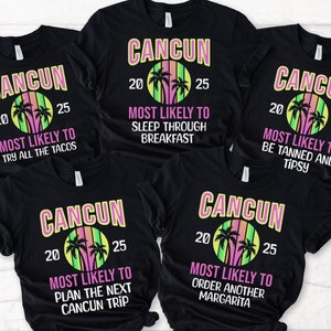 May include: Four black t-shirts with a white graphic design that says "CANCUN" with palm trees and the text "Most Likely To" with a different phrase on each shirt. The shirts are laid out on a wooden surface.