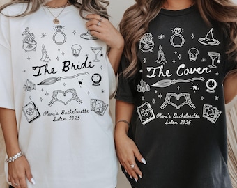 May include: Two oversized t-shirts, one white and one black, featuring a witchy design. The white shirt says "The Bride" and the black shirt says "The Coven". Both shirts have the text "Oliva's Bachelorette Salem 2025".