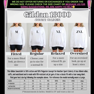 May include: Size chart for Gildan 18000 crewneck sweatshirts. The chart shows measurements in inches for width, length, and sleeve length for sizes S through 5XL. The chart also includes information about the fit of the sweatshirt, which is described as fitted, regular, relaxed, or oversized.