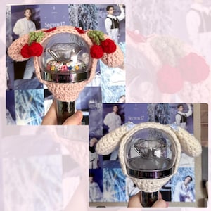 May include: Two crocheted light-up fan covers in the shape of a puppy dog. The first cover is pink with red cherries and the second cover is white. Both covers have a clear plastic sphere with a diamond-shaped light inside.