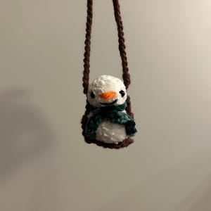 Snowman on a Swing