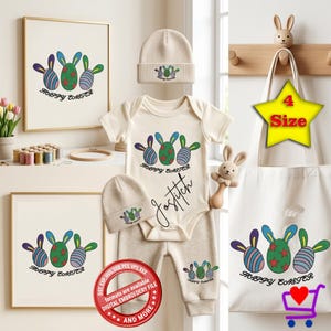 Op de afbeelding: Een op Pasen geïnspireerde set met een babybody, broek en muts, allemaal met een kleurrijk konijn- en eierontwerp. De set bevat een draagtas, ingelijste kunstprints en een konijnenrammelaar. De tekst "HAPPY EASTER" is zichtbaar.