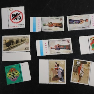 May include: A collection of eight rectangular postage stamps from China, featuring various designs including a SARS awareness stamp, historical figures, a colorful animal illustration, and traditional calligraphy, all with serrated edges.