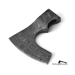 May include: A hand-forged axe head with a unique, patterned finish. The axe head is made of steel and has a curved shape. The text "TheForgedFactory™" is visible in the lower right corner of the image.