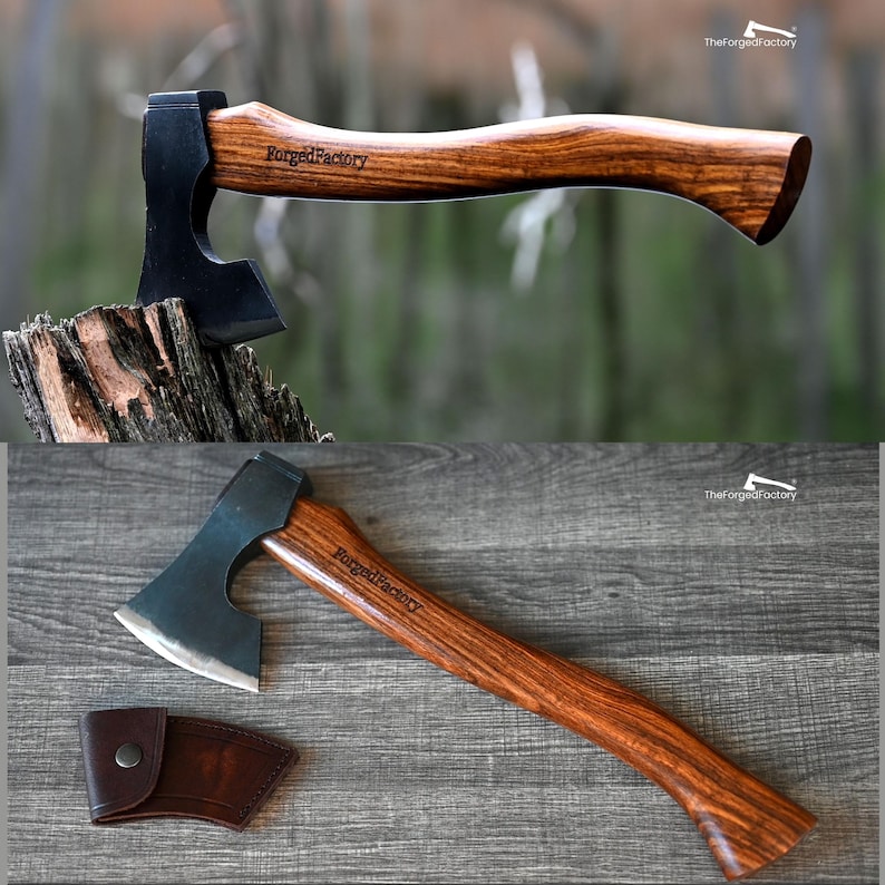 May include: Axe with a dark blade and a wooden handle. The handle is engraved with "ForgedFactory". The axe is shown on a tree stump and a wooden surface. A brown leather sheath is also included.
