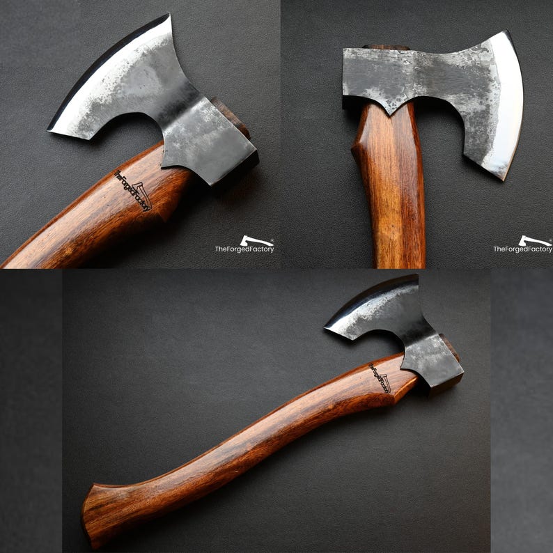 May include: Axe with a dark, weathered steel blade and a polished wooden handle. The handle is a rich brown color, and the blade has a curved cutting edge. The text "TheForgedFactory" is visible on the handle.