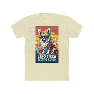 May include: A light beige t-shirt featuring a retro-style graphic of a corgi wearing sunglasses and sitting in front of a laptop. The text "ZERO STRESS SYSTEM ADMIN" is below the image.