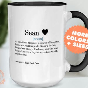 a white and black coffee mug with a poem on it