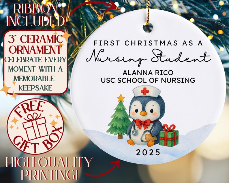May include: A white ceramic Christmas ornament with gold hanging string. The ornament features a penguin in a nurse's hat, a Christmas tree, and a gift. Text reads "First Christmas as a Nursing Student" and "2025". The ornament is 3 inches in diameter.