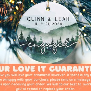 a personalized ornament hanging from a christmas tree
