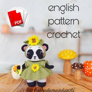 May include: Crochet pattern for a panda wearing a green dress with yellow sunflowers. The pattern is available as a PDF download. The panda is holding a basket of colorful eggs.