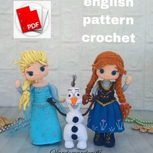 May include: Crocheted dolls of Elsa, Anna, and Olaf from the movie Frozen. Elsa wears a blue dress with a cape, Anna has a black bodice and blue skirt, and Olaf is a white snowman. The words "english pattern crochet" are visible.