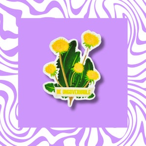 May include: A sticker featuring a green dandelion plant with yellow flowers and the text "Be Ungovernable".