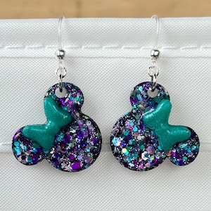 mickey head earrings, Minnie Mouse earrings - resin mouse heads filled with purple/silver/teal holographic glitter with matching pearlescent teal bow