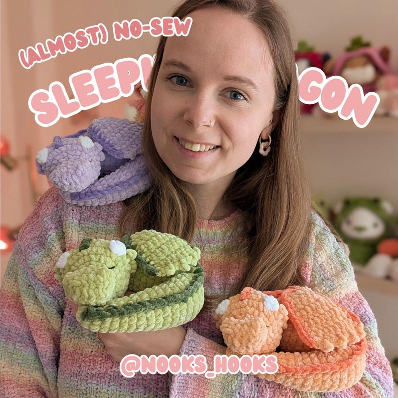 May include: A woman holding three crocheted dragon plushies in shades of green, orange, and purple. The dragons are curled up, with white accents on their wings and bellies. Text on the image reads "(Almost) No-Sew Sleepy Dragon" and "@nooks_hooks".