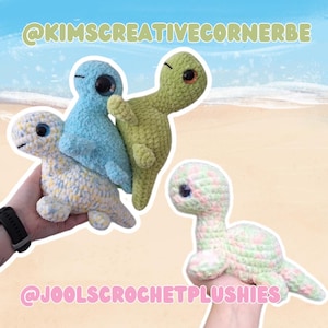 May include: A collection of handmade crochet turtle plushies in various colors. The turtles are in shades of blue, green, and pastel colors. The image includes the text "@KIMSCREATIVECORNERBE" and "@JOOLSCROCHETPLUSHIES".