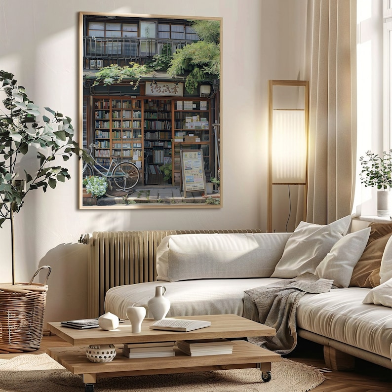 May include: A framed photograph of a bookstore in Japan with a bicycle parked in front. The store has a wooden facade and a sign that reads "古本屋".