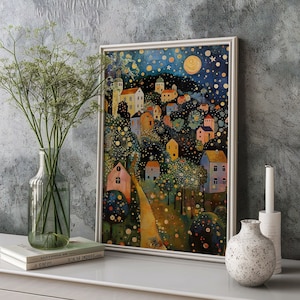 May include: A framed painting of a whimsical village scene with colorful houses, trees, and a winding path. The sky is a dark blue with white stars and a bright yellow moon.