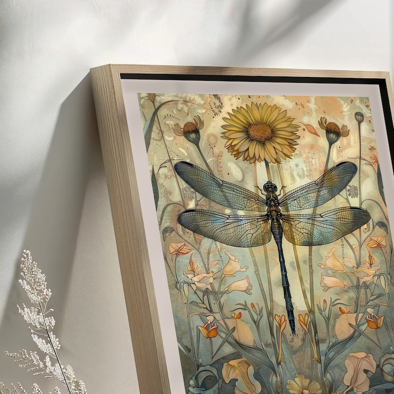 May include: A framed print of a dragonfly with blue wings and a black body, surrounded by yellow, orange, and white flowers. The background is a watercolor wash of blue, green, and brown.