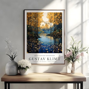 May include: A framed art print featuring a landscape painting in the style of Gustav Klimt. The artwork depicts a river scene with trees and golden orbs. Text at the bottom reads "20TH CENTURY EXHIBITION GUSTAV KLIMT".