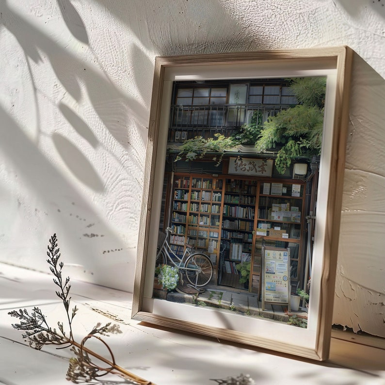 May include: A framed photograph of a bookstore in Japan. The storefront is covered in greenery and has a sign that reads "本屋". A bicycle is parked in front of the store.