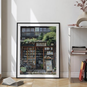 May include: A framed photograph of a bookstore in Japan. The storefront is lined with bookshelves filled with books. A bicycle is parked in front of the store. The store is decorated with plants and flowers.