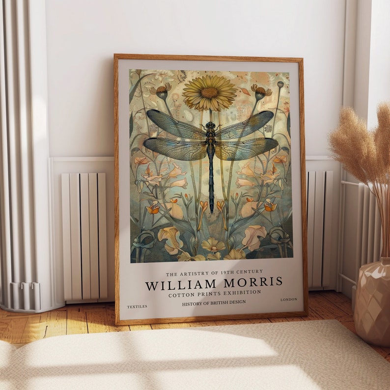 May include: A vintage poster featuring a dragonfly with blue wings and a yellow flower. The poster is titled "William Morris Cotton Prints Exhibition" and is part of a series on the history of British design.