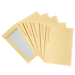 May include: A stack of six brown envelopes with the words "Please do not bend" printed on each one.