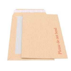 May include: A brown paper envelope with a white strip of tape across the top and the words "Please do not bend" printed in red on the right side.